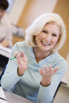 Royalty Free Photo of a Smiling Woman in a Class