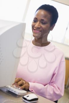 Royalty Free Photo of a Woman at a Computer