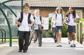 Royalty Free Photo of Students Leaving School