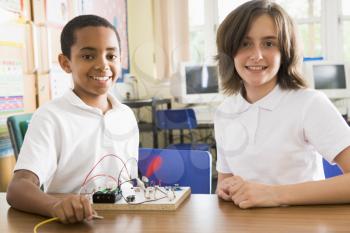 Royalty Free Photo of Students With an Electronics Project