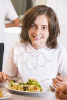 Royalty Free Photo of a Girl in a Cafeteria