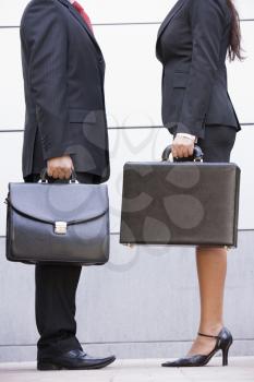 Royalty Free Photo of Two Businesspeople With Briefcases
