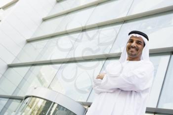 Royalty Free Photo of an Arabian Man Outside a Building