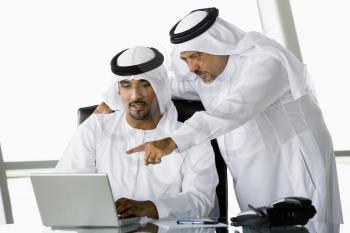 Royalty Free Photo of Two Eastern Men With a Laptop