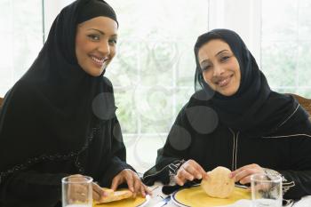 Royalty Free Photo of Two Women Eating