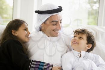 Royalty Free Photo of a Father and Two Children