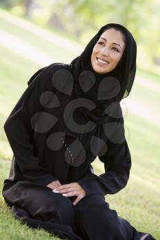 Royalty Free Photo of a Woman Sitting Outside