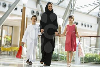 Royalty Free Photo of a Woman With Two Children at the Mall