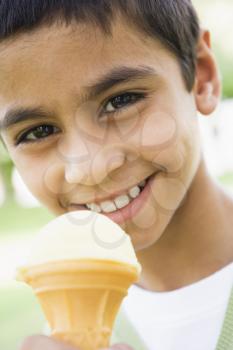 Royalty Free Photo of a Boy Eating Ice Cream