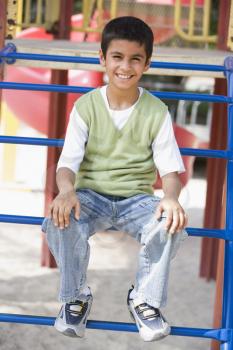 Royalty Free Photo of a Young Boy at a Playground