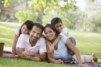 Royalty Free Photo of a Family Lying on the Grass