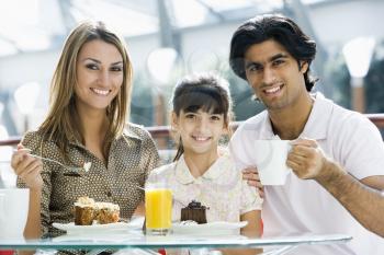 Royalty Free Photo of a Family Eating at a Restaurant