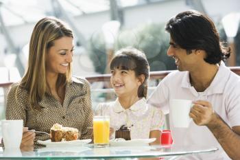 Royalty Free Photo of a Family Eating Dessert