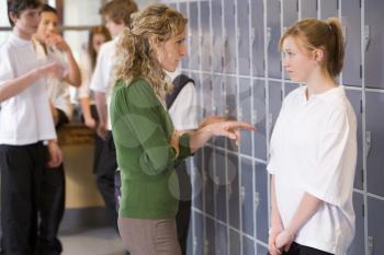 Royalty Free Photo of a Teacher Scolding a Student