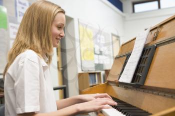 Royalty Free Photo of a Student Playing Piano