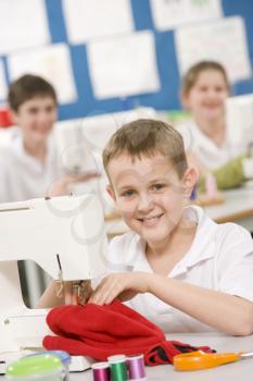 Royalty Free Photo of a Boy Sewing