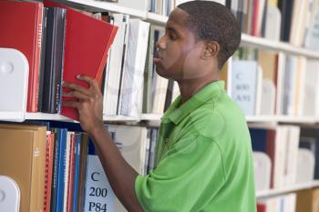 Royalty Free Photo of a Boy in a Library