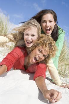 Royalty Free Photo of Three Women in the Sand