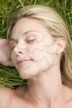 Royalty Free Photo of a Woman Asleep on the Grass