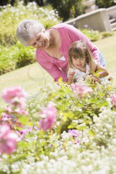 Royalty Free Photo of a Grandmother and Granddaughter in the Garden