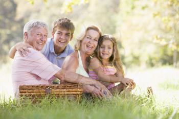 Royalty Free Photo of People Having a Picnic With Their Grandchildren