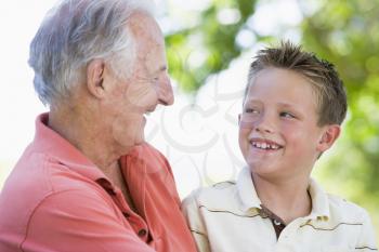 Royalty Free Photo of a Man and His Grandson Outside