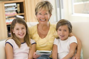 Royalty Free Photo of a Woman Reading to Her Grandchildren