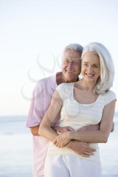 Royalty Free Photo of a Couple Embracing at the Beach