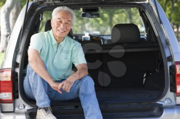 Royalty Free Photo of Man Sitting in a Hatchback