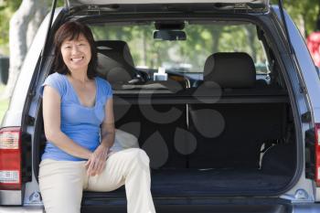Royalty Free Photo of a Woman in the Back of a Hatchback