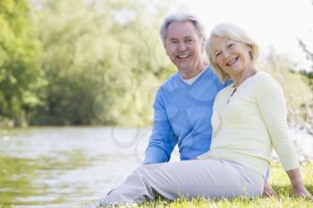 Royalty Free Photo of a Couple Beside a Lake