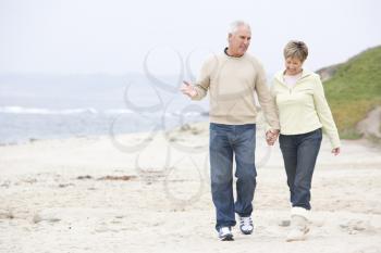 Royalty Free Photo of a Couple Walking at the Beach