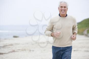 Royalty Free Photo of a Man Running on the Beach