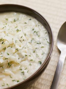 Royalty Free Photo of a Bowl of White Onion and Cider Soup