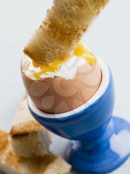 Royalty Free Photo of Toast Being Dipped in Egg