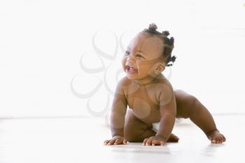 Royalty Free Photo of a Happy Baby Crawling on the Floor