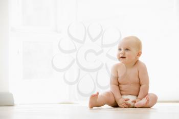 Royalty Free Photo of a Baby on the Floor