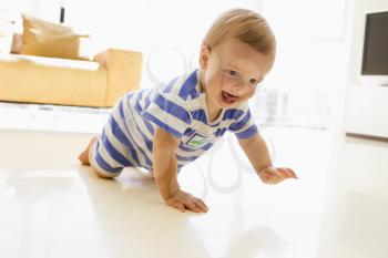 Royalty Free Photo of a Baby Crawling on a Floor