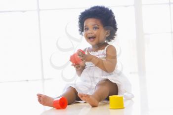Royalty Free Photo of a Baby Playing With Blocks