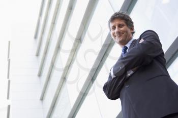 Royalty Free Photo of a Businessman Outside a Building