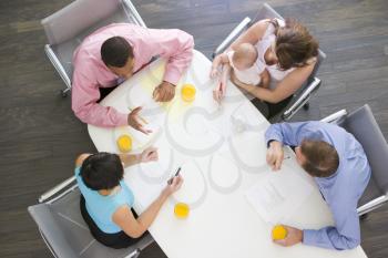 Royalty Free Photo of People and a Baby in a Boardroom
