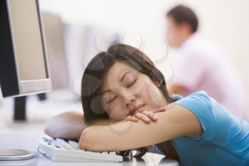 Royalty Free Photo of a Woman Asleep on a Computer