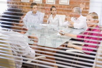 Royalty Free Photo Looking Through a Window at Five People in a Boardroom
