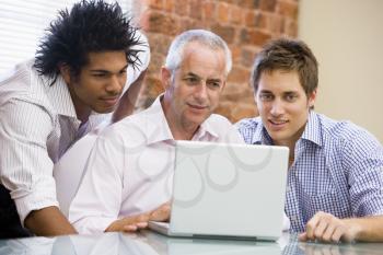 Royalty Free Photo of Three Men at a Laptop