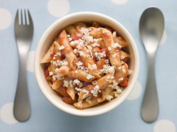 Royalty Free Photo of Penne Pasta Tomato Sauce and Grated Cheese