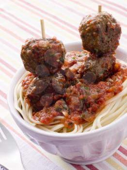 Royalty Free Photo of Spaghetti With Meatball Sticks and Spicy Tomato Sauce