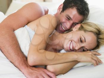 Royalty Free Photo of a Couple in Bed