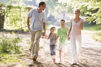 Royalty Free Photo of a Family Walking on a Country Trail