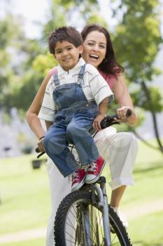 Royalty Free Photo of a Woman and Little Boy on a Bike