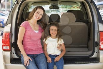 Royalty Free Photo of a Woman With a Girl in a Hatchback